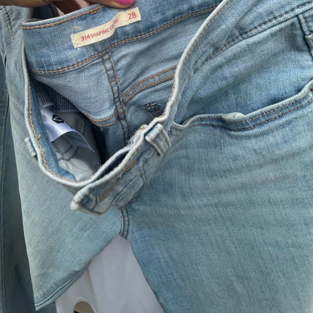 Levi’s 314 Skinny Jeans with Silver Zipper and Contrasting Stitching